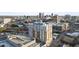 Picturesque aerial shot of apartment building surrounded by city skyline with lush greenery at 400 W North St # 730, Raleigh, NC 27603