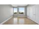 Bedroom with hardwood floors, neutral paint color and large windows with great city views at 400 W North St # 730, Raleigh, NC 27603