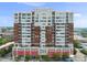 The building exterior is a high rise with mixed brick and concrete elements and multiple balconies at 400 W North St # 730, Raleigh, NC 27603