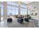Spacious room with soaring ceilings, large windows, and a comfortable seating area with an amazing view at 400 W North St # 730, Raleigh, NC 27603