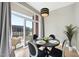 Contemporary dining area with seating for four and a balcony at 400 W North St # 730, Raleigh, NC 27603
