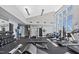 Community gym featuring weights, machines, and ample natural light at 400 W North St # 730, Raleigh, NC 27603