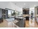 Modern kitchen featuring granite countertops, dark cabinetry, stainless steel appliances, and a breakfast bar with seating at 400 W North St # 730, Raleigh, NC 27603