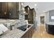 Close up view of updated kitchen featuring a smooth cooktop and stainless steel range hood at 400 W North St # 730, Raleigh, NC 27603