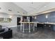 This social kitchen features stainless appliances, granite countertops and central gathering area at 400 W North St # 730, Raleigh, NC 27603