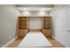 Cozy living area with light-colored walls, hardwood floors, and a built-in unit with a fold-down bed at 400 W North St # 730, Raleigh, NC 27603