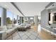 Inviting living room with natural light, comfortable seating, stylish decor, and access to a balcony at 400 W North St # 730, Raleigh, NC 27603