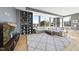 Spacious living room with built-in shelving, large windows, comfortable sofas, and a patterned rug at 400 W North St # 730, Raleigh, NC 27603