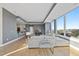 Open-concept living room featuring city views, modern decor, comfortable seating, and a stylish breakfast bar at 400 W North St # 730, Raleigh, NC 27603