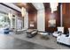 This elegant lobby boasts stylish seating, modern chandeliers, and rich wood paneling for a sophisticated entrance at 400 W North St # 730, Raleigh, NC 27603