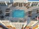 Aerial view of rooftop pool and deck with lounge seating overlooking the city at 400 W North St # 730, Raleigh, NC 27603