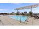 Rooftop pool with lounge chairs, patio tables and chairs and overhead awning at 400 W North St # 730, Raleigh, NC 27603