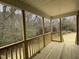 Covered back porch with wood ceiling and railings at 416 Magnolia Run Way, Benson, NC 27504
