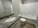 Bright bathroom features a granite countertop and white cabinetry at 416 Magnolia Run Way, Benson, NC 27504