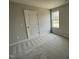 Bedroom featuring neutral walls, carpet and white door at 416 Magnolia Run Way, Benson, NC 27504