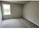 Bedroom featuring neutral walls, carpet and a bright window at 416 Magnolia Run Way, Benson, NC 27504
