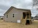 Exterior view of new home with covered porch at 416 Magnolia Run Way, Benson, NC 27504