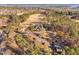 Scenic aerial view of a house adjacent to a golf course surrounded by forest at 43 New Rhododendron, Chapel Hill, NC 27517