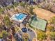 Aerial view of community pool, tennis court, and parking area at 43 New Rhododendron, Chapel Hill, NC 27517