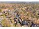 Residential aerial view of properties near lake and golf course, showcasing landscaping and large plots at 43 New Rhododendron, Chapel Hill, NC 27517