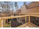 View of a back porch overlooking landscaping and other outdoor living areas at 43 New Rhododendron, Chapel Hill, NC 27517