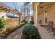 Landscaped backyard with stone pathway and trimmed hedges leading to porch at 43 New Rhododendron, Chapel Hill, NC 27517