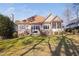 Beautiful backyard featuring a well-manicured lawn, patio, and screened-in porch at 43 New Rhododendron, Chapel Hill, NC 27517