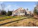 Beautiful backyard with patio area, lush lawn, and mature trees at 43 New Rhododendron, Chapel Hill, NC 27517