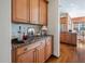 Convenient bar area with custom cabinets, granite countertops, and easy access to the kitchen at 43 New Rhododendron, Chapel Hill, NC 27517