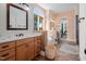 Bright bathroom with double sinks, bathtub, and separate walk-in closet at 43 New Rhododendron, Chapel Hill, NC 27517