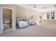Spacious bedroom featuring two twin beds, ensuite bathroom, and a large window at 43 New Rhododendron, Chapel Hill, NC 27517