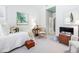 Bright bedroom featuring neutral paint, a sitting area, and ensuite bathroom access at 43 New Rhododendron, Chapel Hill, NC 27517