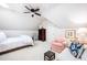 Spacious bedroom with a vaulted ceiling and a sitting area with a plush pink chair at 43 New Rhododendron, Chapel Hill, NC 27517