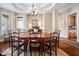 Elegant dining room with a tray ceiling, chandelier, and ample seating for large gatherings at 43 New Rhododendron, Chapel Hill, NC 27517