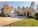 Charming home featuring stone accents, a two-car garage and a spacious driveway at 43 New Rhododendron, Chapel Hill, NC 27517