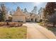 Beautiful home with manicured lawn and attractive landscaping at 43 New Rhododendron, Chapel Hill, NC 27517