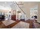Elegant foyer showcasing staircase, hardwood floors, and an open-concept design at 43 New Rhododendron, Chapel Hill, NC 27517