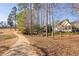 Picturesque view of golf course with mature trees and winding sidewalk, creating a serene outdoor setting at 43 New Rhododendron, Chapel Hill, NC 27517