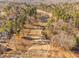 Scenic aerial view of the golf course winding through lush trees at 43 New Rhododendron, Chapel Hill, NC 27517