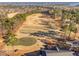 Aerial view of a golf course with manicured greens and fairways near the water at 43 New Rhododendron, Chapel Hill, NC 27517