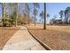 Scenic golf course with walking path and trees. Large property in the background offers a relaxing lifestyle at 43 New Rhododendron, Chapel Hill, NC 27517