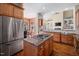 Well-equipped kitchen with granite countertops, stainless steel appliances, and a central island at 43 New Rhododendron, Chapel Hill, NC 27517
