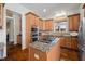 Charming kitchen featuring custom cabinets, granite counters, and a center island with a cooktop at 43 New Rhododendron, Chapel Hill, NC 27517