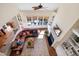 Bright living room with high ceilings, fireplace, and large windows offering natural light and backyard view at 43 New Rhododendron, Chapel Hill, NC 27517