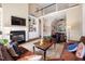 Spacious living room with a fireplace, built-in shelves, and comfortable leather seating at 43 New Rhododendron, Chapel Hill, NC 27517