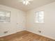 Bedroom with light-colored walls, light-colored floors, white door, and natural light from the window at 431 Mattox St, Wendell, NC 27591