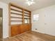 Bedroom with light-colored walls, light-colored floors, ceiling fan, built-in bookshelf, and closet at 431 Mattox St, Wendell, NC 27591