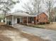 Charming brick home with a carport and well-manicured front yard at 431 Mattox St, Wendell, NC 27591