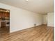 Bright living room with light-colored walls, light-colored floors, and kitchen access at 431 Mattox St, Wendell, NC 27591