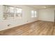 Bright living room with light-colored walls, light-colored floors, and multiple windows at 431 Mattox St, Wendell, NC 27591
